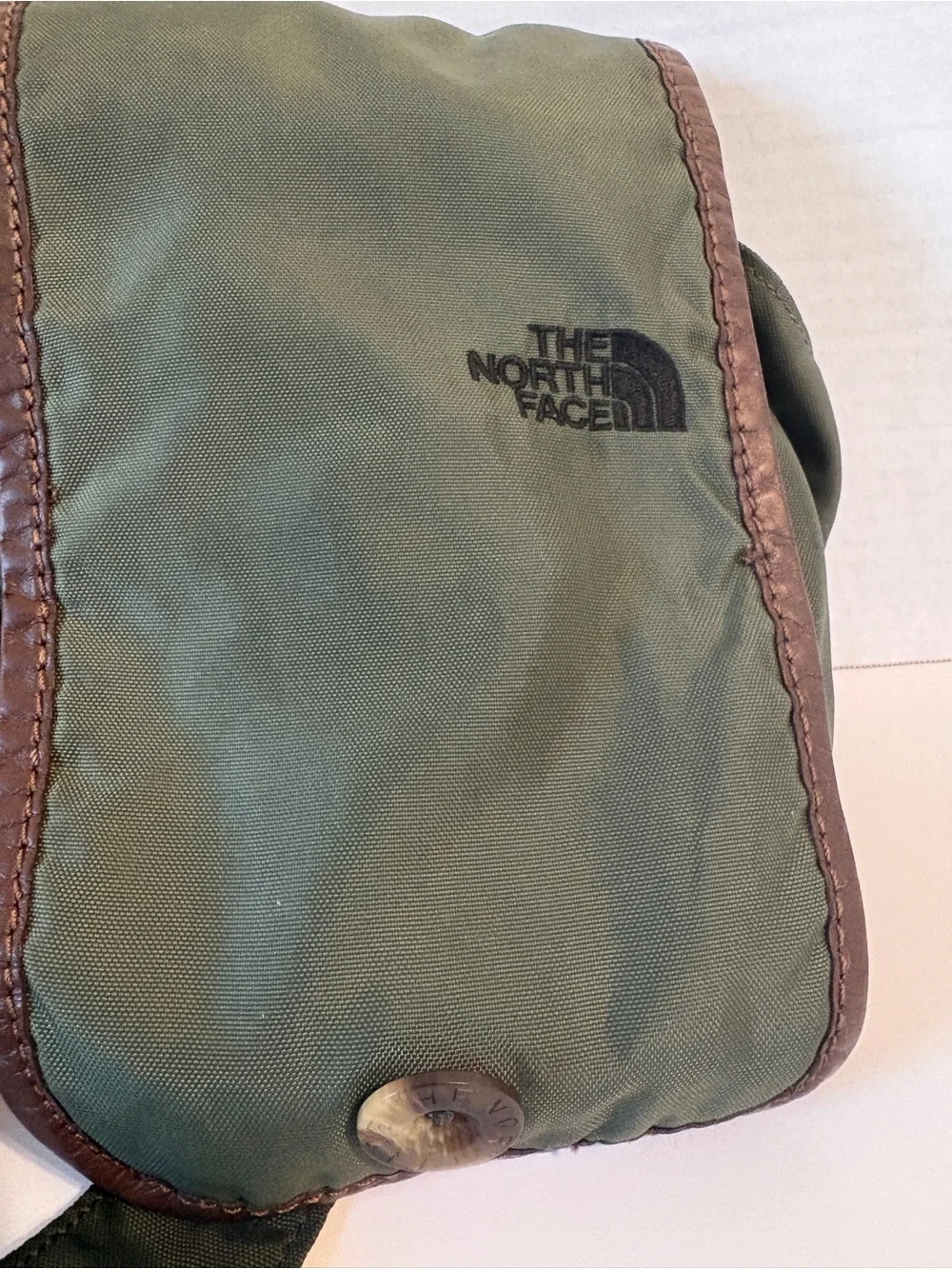 The North Face compact messenger